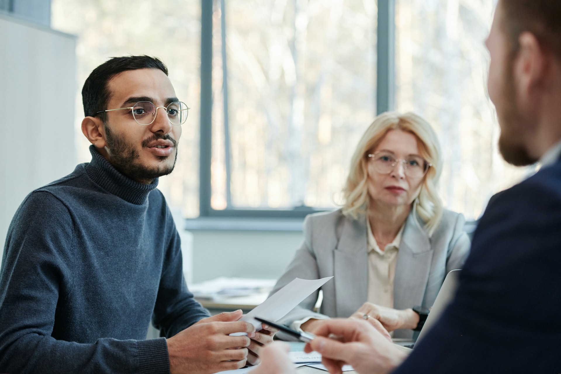 Three people in a meeting