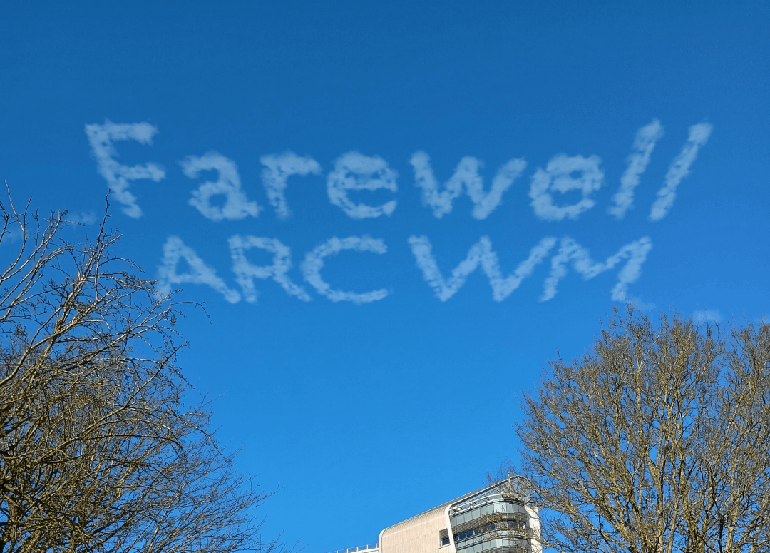 Photo of blue sky above UHBFT with 'Farewell ARC WM' written in sky-writing